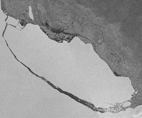 Once king of the seas, a giant iceberg is finally breaking up
