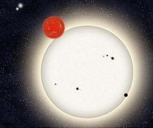 Armchair astronomers find planet in four-star system