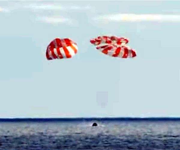 Orion splashes down after record-setting voyage around the Moon