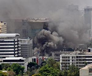 Thai forces escort firefighters to massive mall blaze