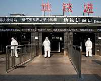 Beijing lifts some lockdowns as virus cases drop