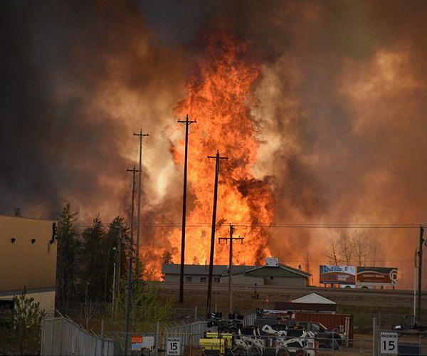 Rain in Canada's east aids mass firefighting effort