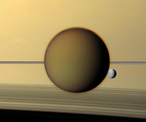 Cassini Images Titan and Dione Above Saturn