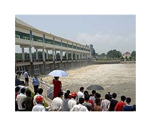 Police, protesters clash over China dam