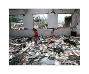 Schoolbooks strewn in China quake rubble as children perish