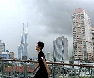 China vows to keep tight grip on property prices