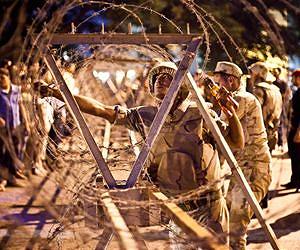 Amid crisis, Egyptians fear return to security state
