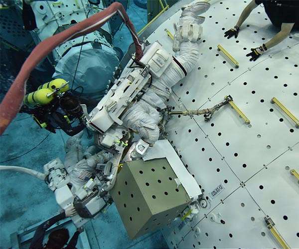 Prepping for a spacewalk to install Colka on ISS external hull