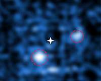Pair of Fledgling Planets Seen Growing Around Young Star