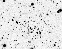 Far from home: Wayward cluster is both tiny and distant