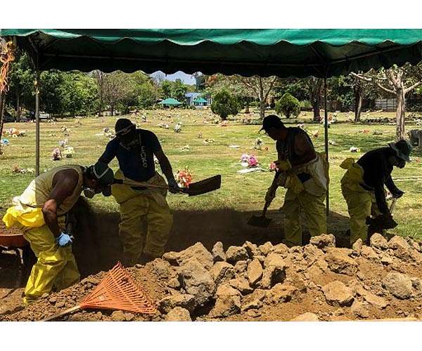 Iraqis dig up Covid-19 dead to rebury in family graves