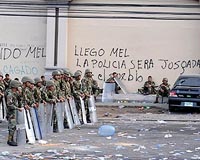 Honduran army surrounds Zelaya in embassy