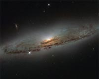Hubble Sees a Supermassive and Super-hungry Galaxy