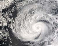 Hurricane looming on Earth, astronauts rush space walk to hasten return