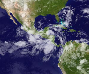 Hurricane, tropical storm combine to kill 19 in Mexico