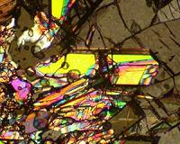 Using lasers to simulate shock effects of meteorite impact on silica