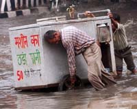Mumbai Commuters Wade Knee-Deep As Monsoon Rains Lash City