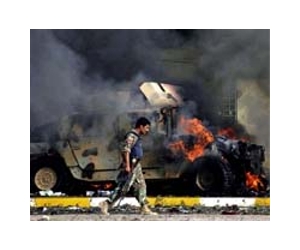 Iraq militants free prisoners, burn police stations