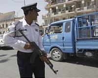Blocking police at checkpoints, Iraqis revel in people power
