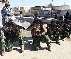Iraqi forces assault gunmen in crisis-hit city