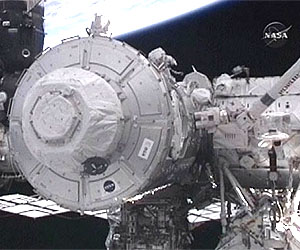 Astronauts outfit space station observation deck