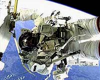 Astronauts cut spacewalk short over suit concerns