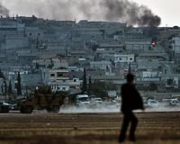 Iraqi fighters lift spirits in Syria siege town