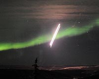 Two Rockets Fly Through Auroral Arc