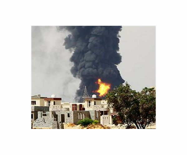 Libya says air force strikes 'smuggler hideouts'