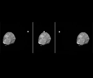 Phobos slips past Jupiter