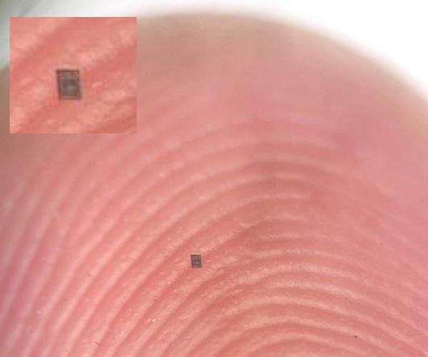 Microscopic light powered robots integrate brain sensor and motor on a speck sized chip