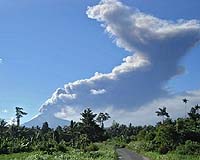 Northern Indonesian volcano spews smoke, heat clouds