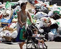 Berlusconi says Naples rubbish crisis is over