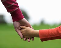 Parents clasp hands of children in ancient graves