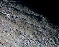 Pluto's 'Snakeskin' Terrain: Cradle of the Solar System?
