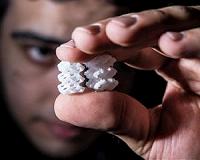 Modified laser cutter prints 3-D objects from powder