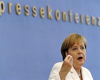 Merkel calls for end to 'massacre' in Syria