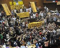 Taiwan protesters vow mass rally in 'war' against China pact