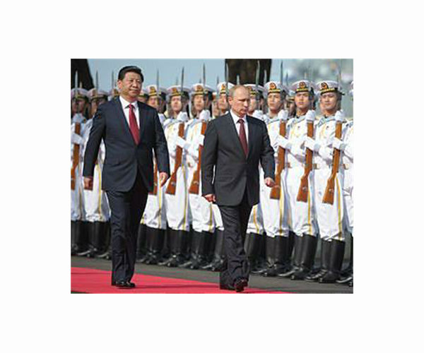 Putin, Xi hail 'great power' ties at talks defying West