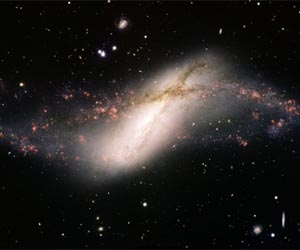 Poetry in Motion: Rare Polar Ring Galaxy Captured in New Image