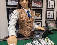 Macau shows off robot croupiers as hopes of recovery rise