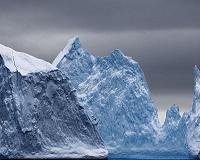 Why does our planet experience an ice age every 100,000 years?