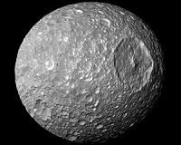Wobbling of a Saturn moon hints at what lies beneath