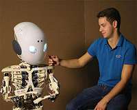 Live interactions with robots increase their perceived human likeness