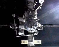 Junk threat averted, Discovery shuttle docks with space station