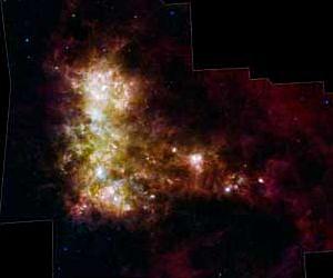 Galaxy Exposes Its Dusty Inner Workings In New Spitzer Image