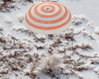 American, two Russians back on Earth after half-year in space