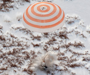 Astronauts return to Earth on Russian spacecraft