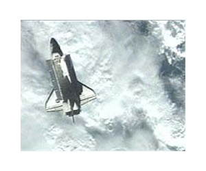 Space shuttle crew head back to Earth