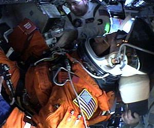 Astronauts Learn Ropes Strapping in Crews